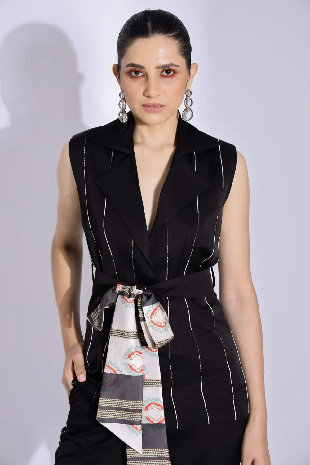 SLEEVELESS BELTED JACKET AND TAPERED PANTS