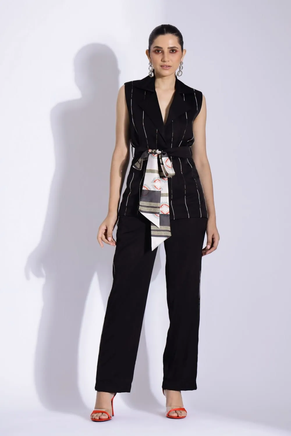 SLEEVELESS BELTED JACKET AND TAPERED PANTS