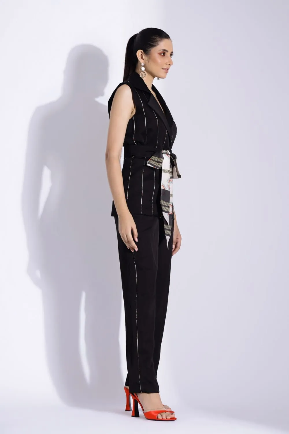 SLEEVELESS BELTED JACKET AND TAPERED PANTS